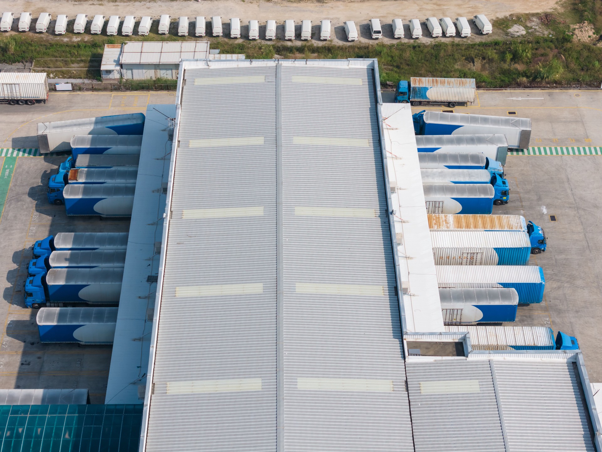 High angle shot of logistics park and large trucks